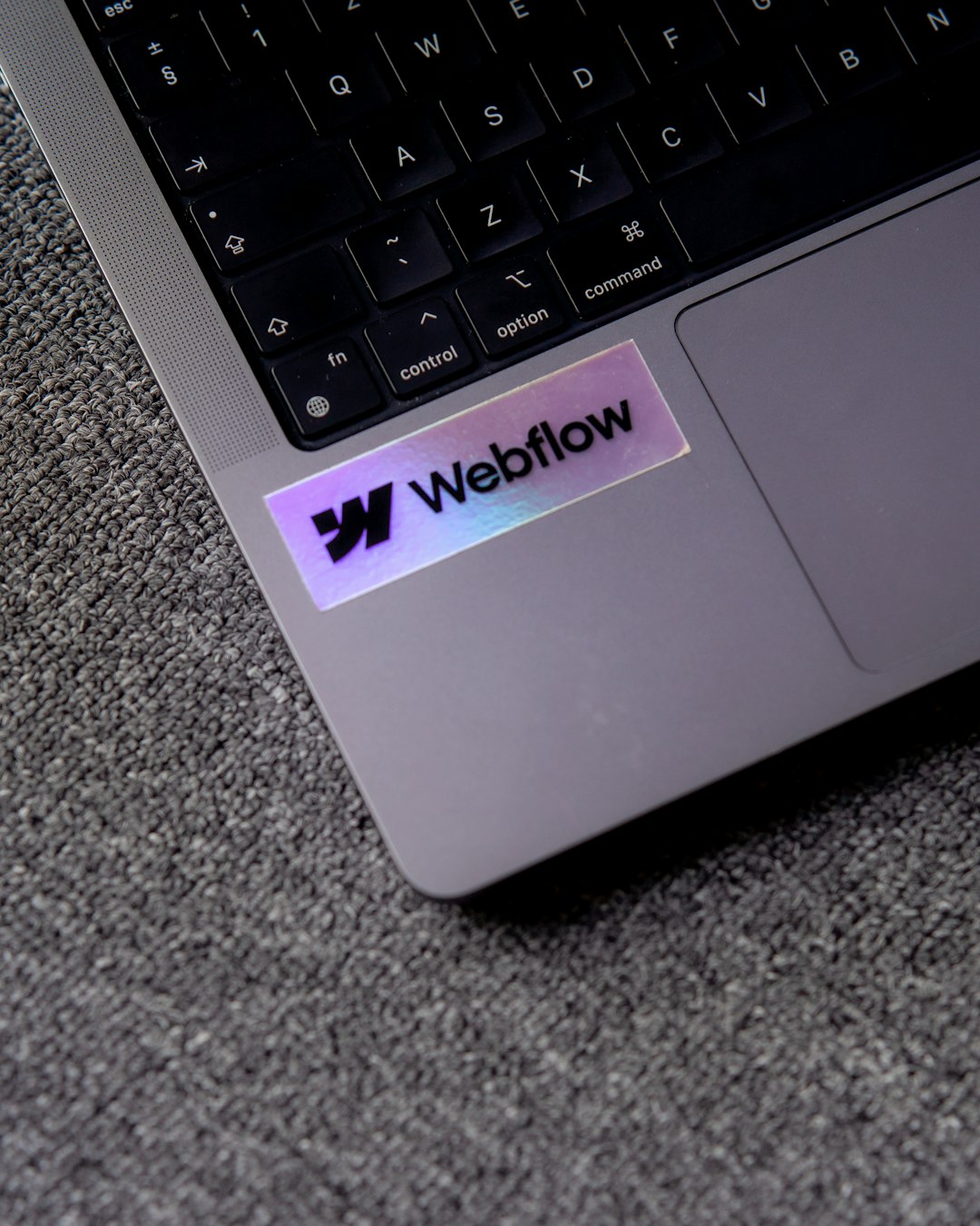 a-close-up-of-a-laptop-with-a-sticker-on-it-bdbuwizi0fa